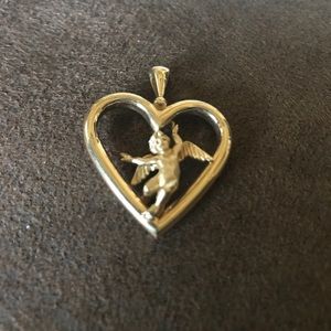 Jewelry - 14 carat gold heart with angel in middle. Jewelry - 14 carat gold heart with angel in middle.